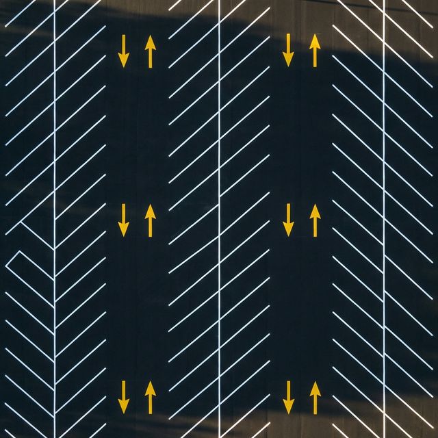 Aerial drone shot of perfectly symmetrical parking lot striping